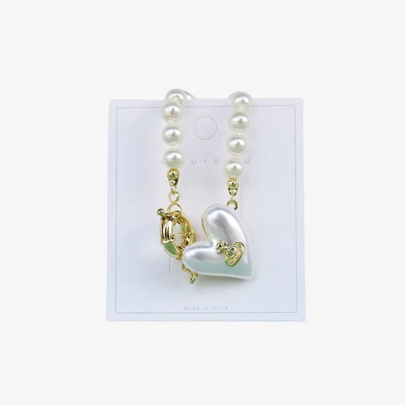 Pulsera con perlas y dije de corazón "Amor eterno"